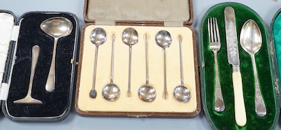 Three assorted silver cased sets, including coffee spoons, christening trio and spoon and pusher.